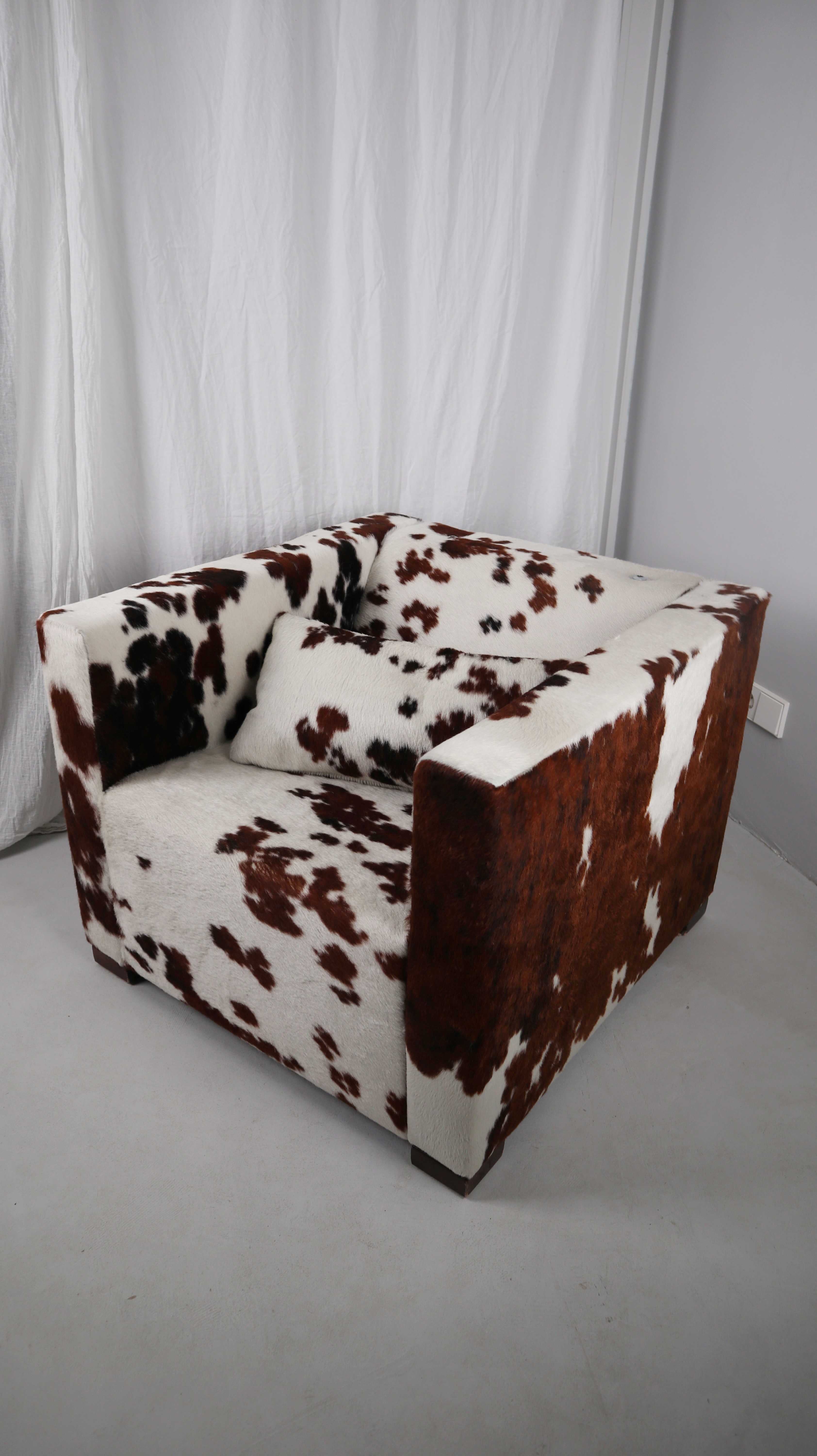 Gyform Sessel Kuhfellsessel braun weiß Kopflehnstütze Fellsessel Design Clubsessel